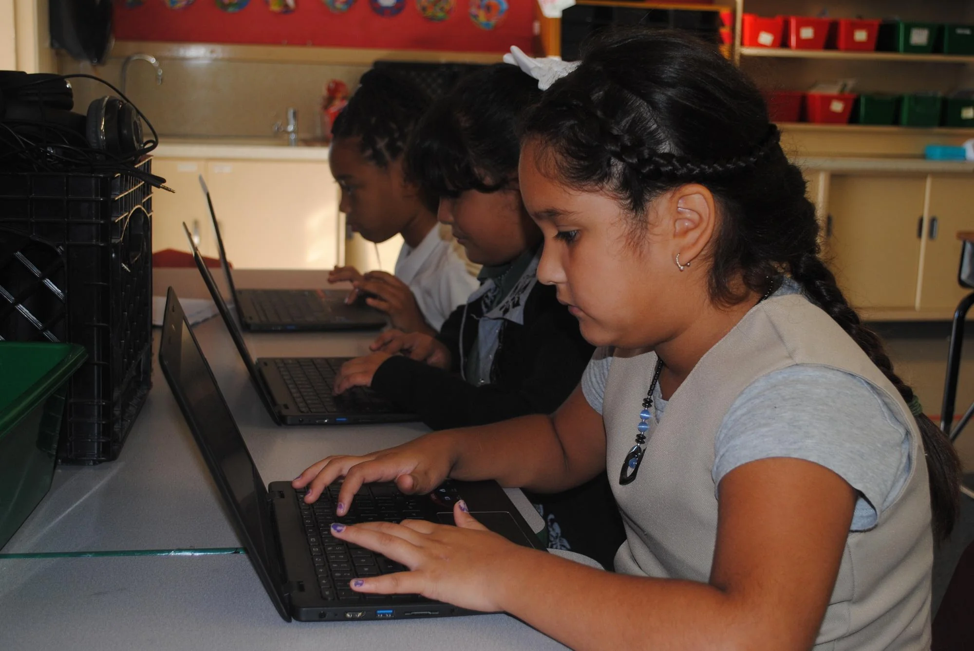 Capitol Collegiate students working on their laptops in class